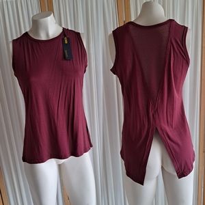 Bamans red sleeveless shirt with mesh back and split cut out on bottom o…